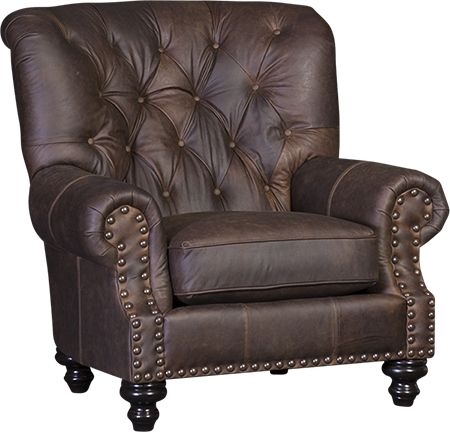 a brown leather chair with studded arms