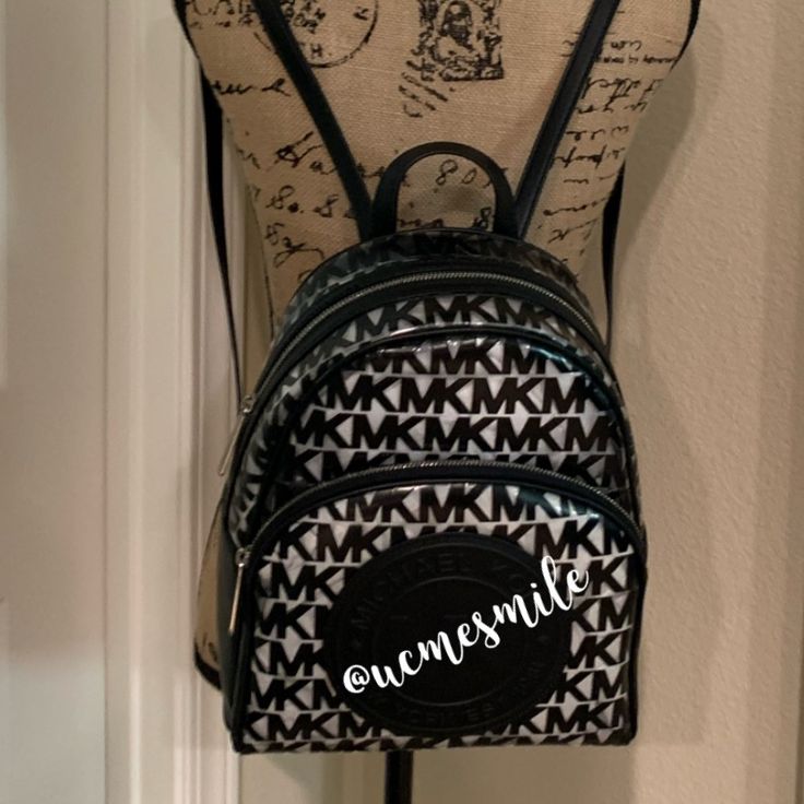 Michael Kors Monogram Casual Style 2way Logo Backpack Nwt! Michael Kors Clear Medium Backpack Black/Black Leather/Plastic Perfect For Vacations, Everyday Use, Sports Events Any Event That Requires A See Through Bag. Signature Plastic, Thermoplastic Polyurethane With Trim Leather Color: Black Double Zip Closure Main Compartment: Zip & 2 Slip Pockets Exterior Pocket Silver Tone Hardware Top Handle 3" Drop Adjustable Leather Straps 12.5"L X 10.5"W X 5"H Smoke Free Home Will Wrap With Care Rare Find Daily Coated Canvas Backpack With Logo, Daily Use Coated Canvas Backpack With Logo, Daily Use Backpack In Coated Canvas With Logo, Everyday Coated Canvas Backpack With Logo, Black Bags With Logo In Coated Canvas, Black Bags With Logo On Coated Canvas, Black Coated Canvas Bags With Logo, Modern Logo Backpack, Designer Backpack With Logo For Everyday Use