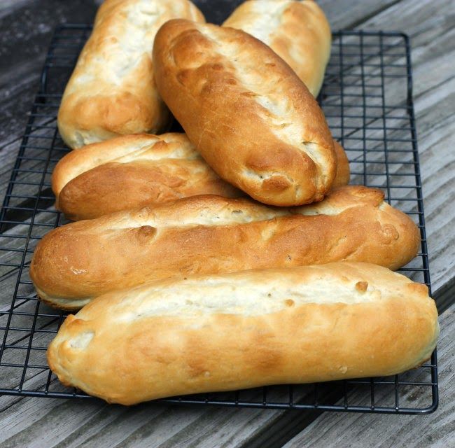 several loaves of bread sitting on a wire rack