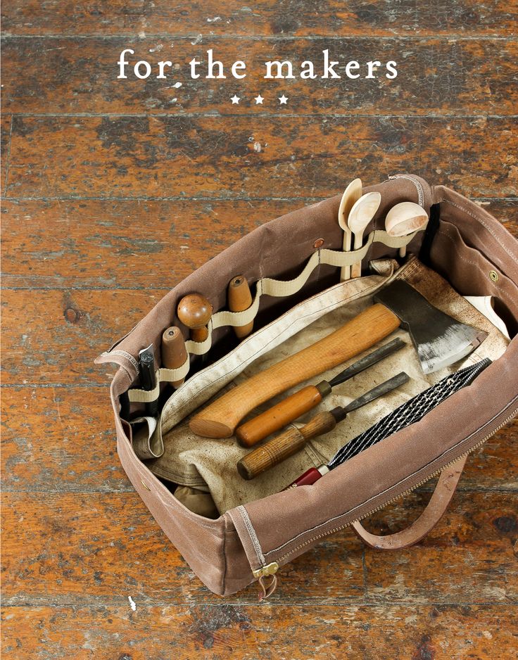 an old bag filled with tools on top of a wooden floor and the words for the makers above it