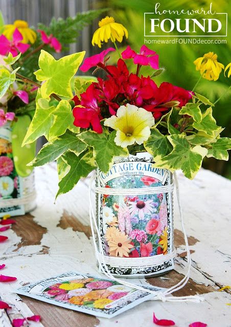 colorful flowers in vases sitting on top of a table with cards and tags next to them