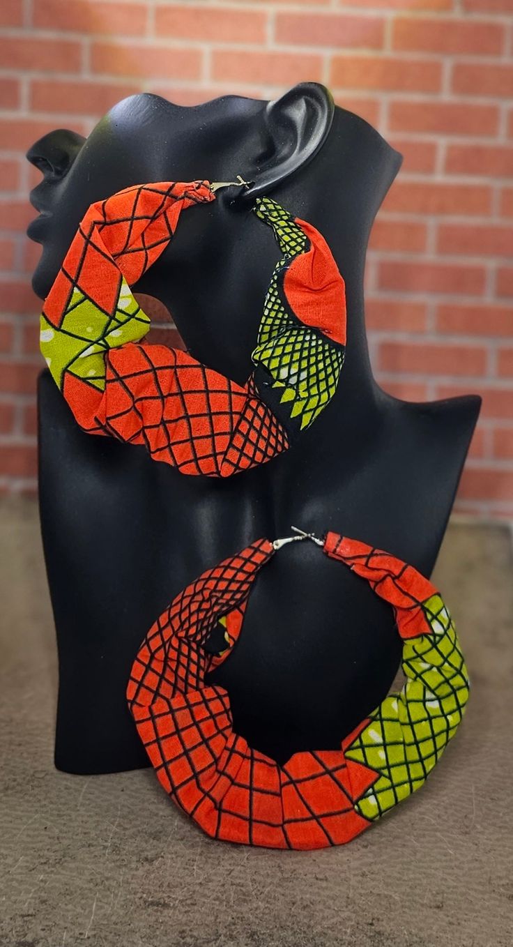 These fabric hoop earrings are lightweight and feature vibrant colors that will compliment your fashion aesthetic. Fabric Hoop Earrings, Photoshoot Accessories, Cloth Earrings, Fashion Collection Inspiration, African Earrings, Hoop Earrings Style, Fabric Earrings, Artisan Earrings, Handcrafted Accessories