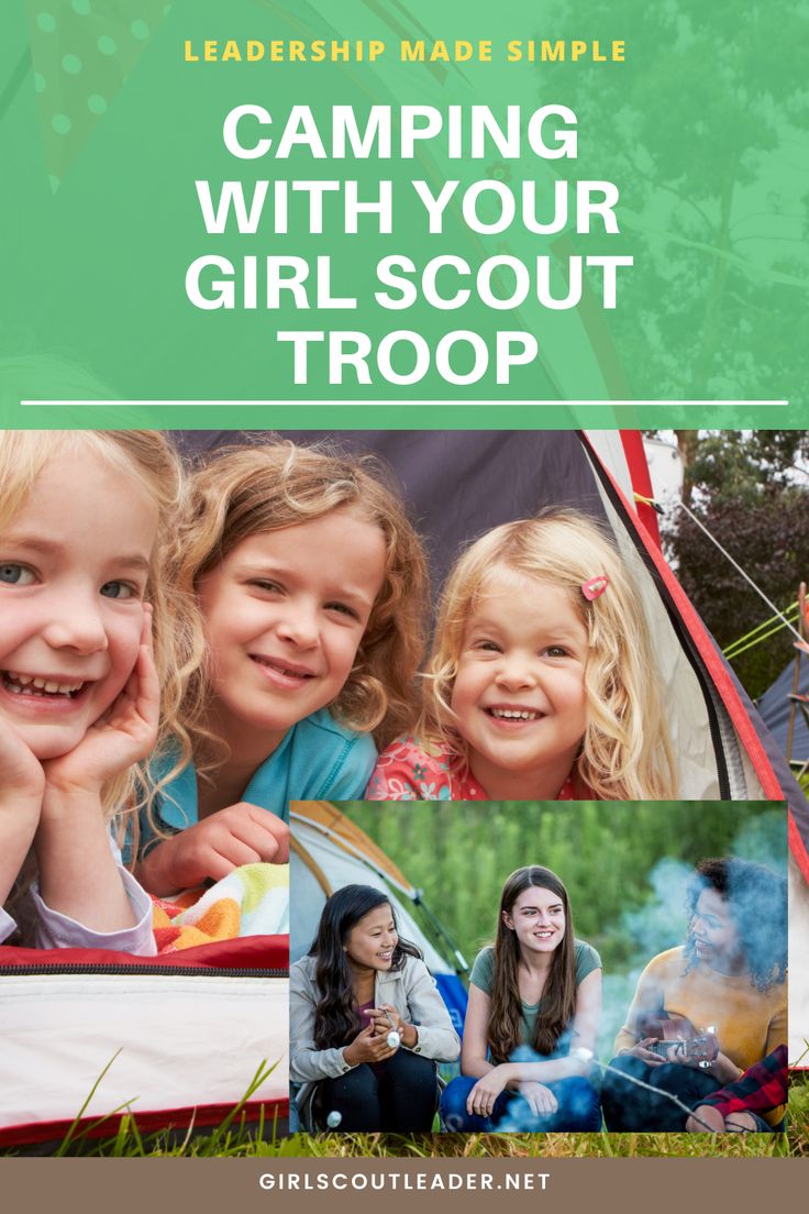 girls camping with their girl scout troop brochure on the grass and trees in the background