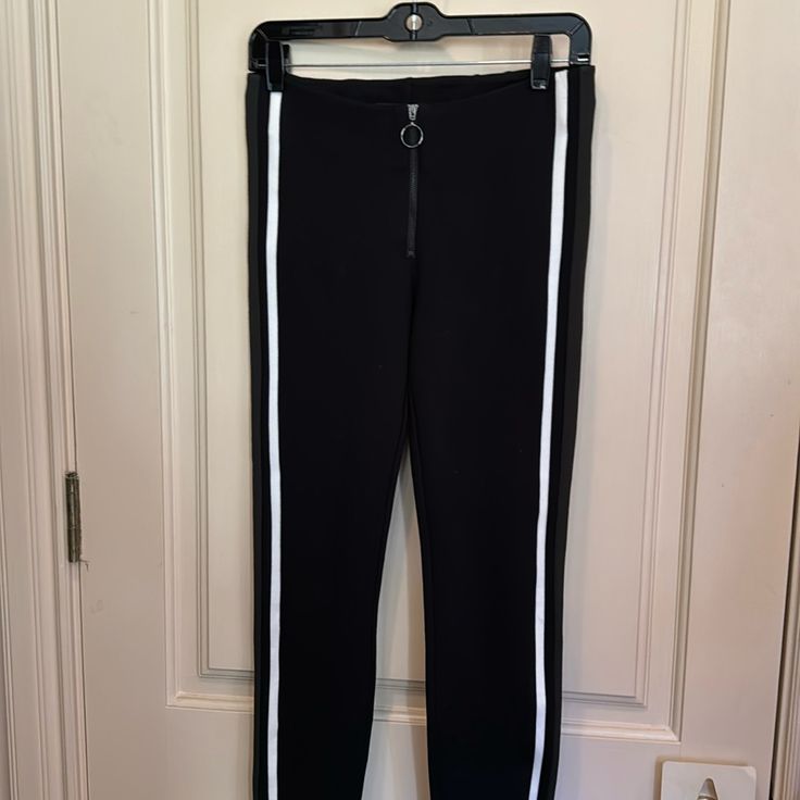 Brand New, Never Used Zara Skinny Tight Pants In Black. It Has A Strip On The Side, With Front Zipper For Perfect Fit For Your Body. Size Medium From Trafaluc Collection, Material Is Tight On Your Body For A Great Fit. Black Stretch Leggings With Zipper Closure, Black Mid-rise Pants With Zipper Closure, Sporty Stretch Pants With Zipper Closure, Trendy Black Ankle-length Leggings, Chic Stretch Leggings With Zipper Closure, Sporty Fitted Bottoms With Zipper Closure, Chic Fitted Black Sweatpants, Black Ankle-length Leggings For Night Out, Trendy Black Straight Leg Leggings