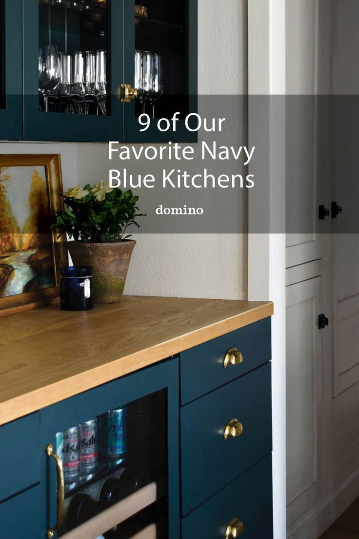 an image of a kitchen with blue cabinets and wine glasses on the counter top that says 9 off our favorite navy blue kitchens