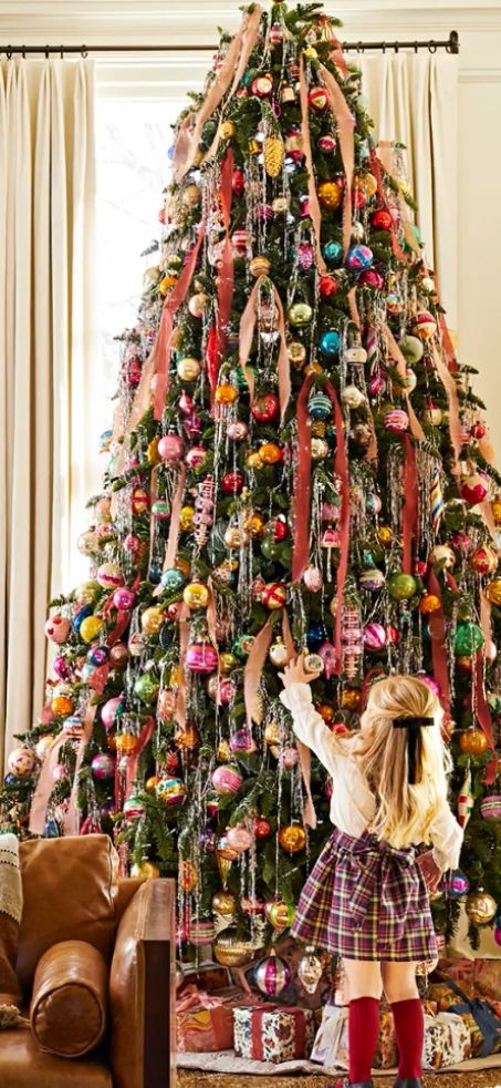 Rainbow Tinsel Christmas Tree, Holiday Merchandising Retail, Flocked Colorful Christmas Tree, Colorful Bow Christmas Tree, Christmas Tree Ideas Rainbow Lights, Chartreuse Christmas Tree, Fabric On Christmas Tree, Multicolor Christmas Tree Lights, Vintage Christmas Exterior Decor