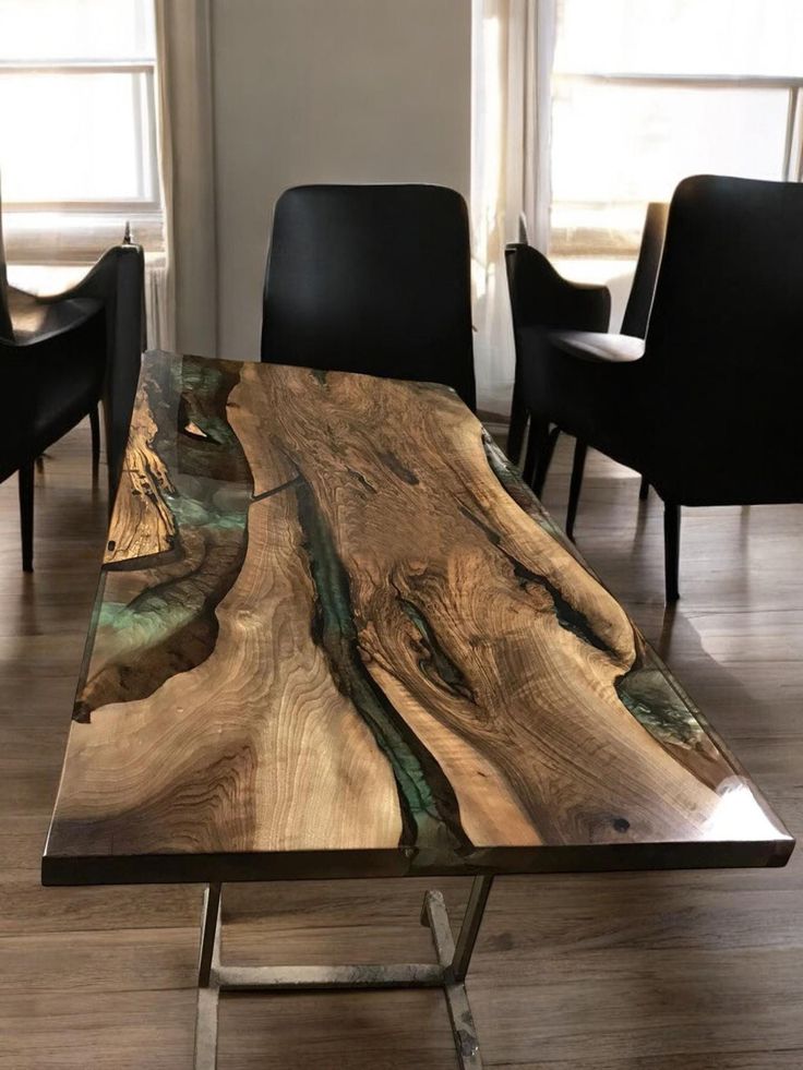 a table made out of wood with chairs around it