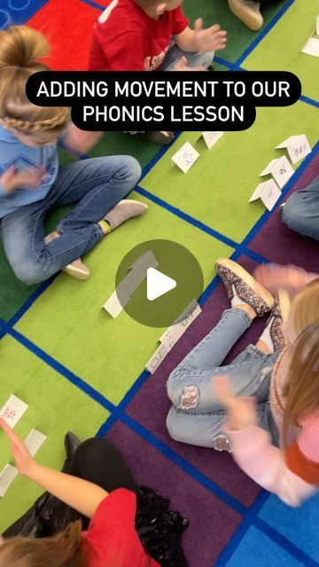 children sitting on the floor playing with their hands