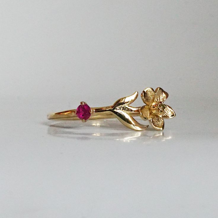 Our special collection of birth flower rings are inspired by the love of wearing something meaningful. Each birth flower is adorned with that month's birthstone. July's birth flower is Water Lily and the birthstone is ruby. Materials: 14K solid gold 2mm natural ruby 1.1mm band thickness ** This item is specially made for you. Please allow 1-2 week lead time. Shipping:Domestic: Free standard shipping within the U.S.International: Free standard shipping for orders over $200 Customization:- Interes Flower Shaped Birthstone Ring For Anniversary, Fine Jewelry Birthstone Flower Promise Ring, Fine Jewelry Flower-shaped Birthstone Promise Ring, Dainty 14k Gold Flower Ring With Birthstone, Yellow Gold Flower Ring With Birthstone For Gift, Yellow Gold Birthstone Flower Ring, Ruby Flower Ring Gift, Fine Jewelry, 14k Gold Birth Flower Rings, Anniversary Yellow Gold Flower Ring With May Birthstone