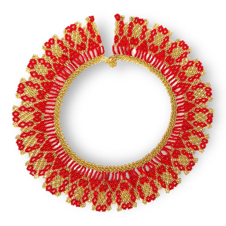 a red and gold necklace on a white background