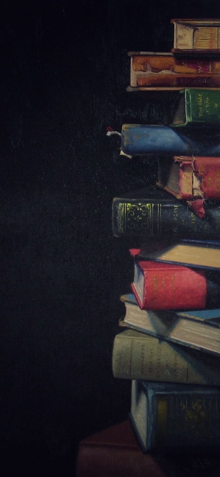 a stack of books sitting on top of each other in front of a black background