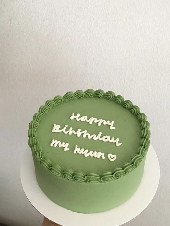 a green birthday cake with the words happy birthday my own written on it in white frosting