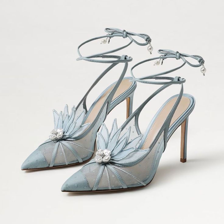 Step into elegance with these light blue mesh stitching floral decor pearl lace-up wedding heels. Featuring intricate detailing, they blend sophistication with a touch of whimsical charm for your special day. Color: Light blue Material: Mesh/Satin Heel Type: Stiletto heel Heel Height: 4.09'' / 104 mm approx Product measurements were taken using size 8. Please note that measurements may vary by size. Toe: Pointy toe Stitching floral decor design Pearl lace-up deign Toe cap design Handcrafted US sizing. Fits true to size. Light Blue Heels, Whimsical Shoes, Unique Wedding Shoes, Concept Clothing, Floral Heels, Blue Accessories, Bridal Heels, Pearl And Lace, Satin Heels