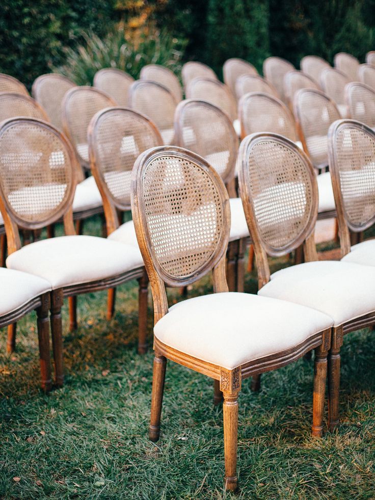 rows of chairs lined up in the grass