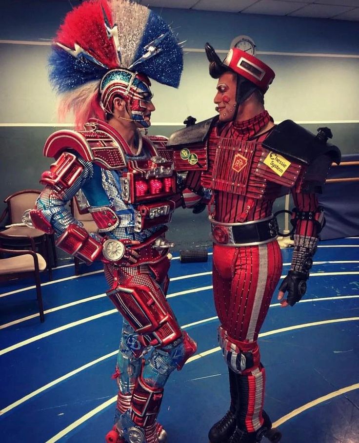 two men in costumes standing next to each other