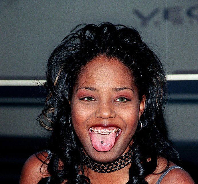 a woman making a funny face with her tongue out