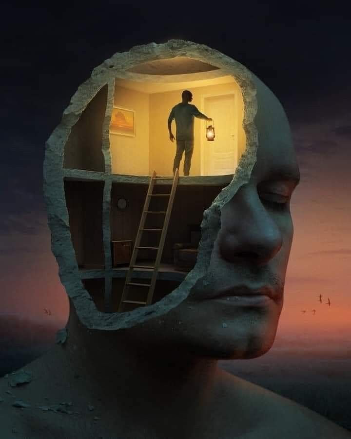 a man is standing in the middle of a room with a ladder to his head