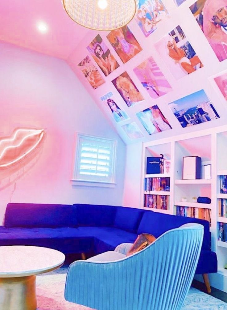 a living room filled with furniture and pictures on the wall above it's bookshelves