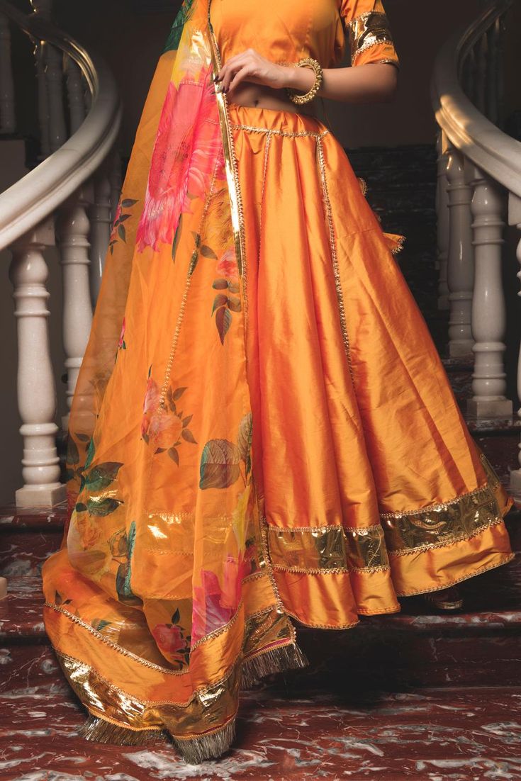 Model Height: 5.6ft Lehenga Length: 40" Model Wear: S Size Available: Customized Fabric: Taffeta Silk Lehenga & Blouse with an Organza Silk Dupatta Blouse: 1meter unstiched blouse cloth SKU#: 11423052OR Disclaimer: Slight Colour variations may occur due to different phone /laptop screen resolution. Washing Instructions: Dry Clean Orange Indian Outfit, Lehenga Beautiful, Silk Lehenga Blouse, Stylish Lehenga, Haldi Dress, Orange Lehenga, Indian Wedding Lehenga, Mustard Orange, Indian Lehenga Choli