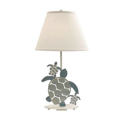 a lamp that has a turtle on it