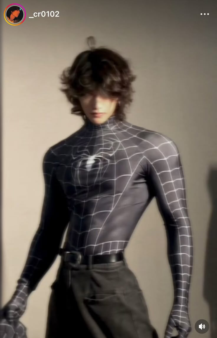 a man in a black and white spider suit