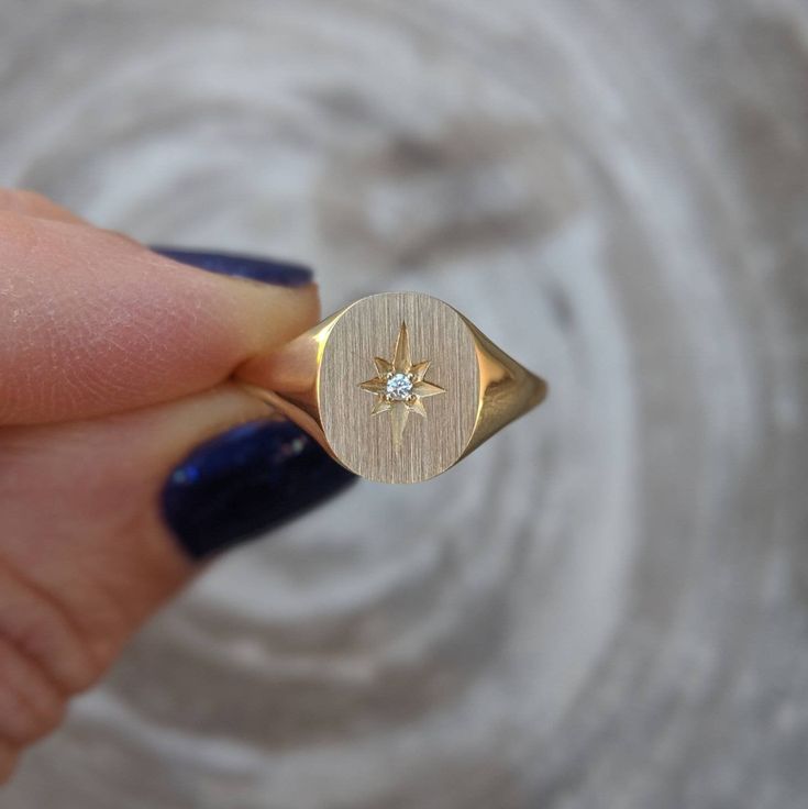 Our solid gold starburst signet ring features a cosmic star set with a sparkling diamond. Choose from 14k, 18k yellow, rose, white gold or platinum. Prefer a colored gemstone in place of the diamond? Just leave us a note at checkout. This ring is a lovely addition to your celestial fine jewelry, and makes a meaningful, timeless (and cool!) gift for your loved ones this holiday season. Details: - Made at our family-run studio in NYC. - Solid 14k, 18k yellow, rose, white gold or platinum -- choose Formal Star-shaped Single Diamond Jewelry, Formal Yellow Gold Starburst Jewelry, Celestial Diamond Rings Stamped 14k, Celestial Style Diamond Signet Ring In Yellow Gold, Luxury 14k Gold Star-shaped Diamond Ring, Elegant Diamond Star-shaped Signet Ring, Elegant Star-shaped Diamond Signet Ring, Starburst Diamond Jewelry For Anniversary, Elegant Diamond Star Signet Ring