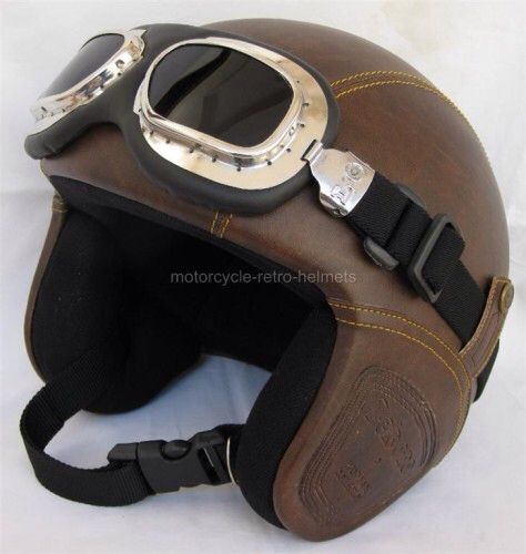 an old motorcycle helmet with goggles on it