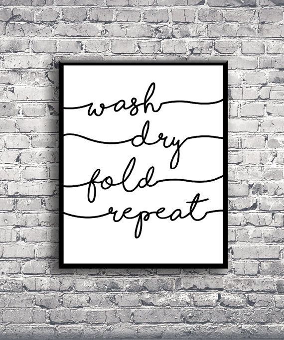 a black and white poster on a brick wall with the words wash dry fold repeat