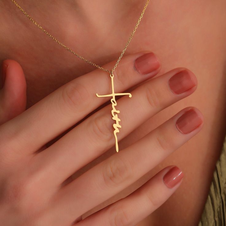 "14K solid gold Faith Cross Necklace would be the perfect Christmas gift for your daughter, wife, or mother. Our Faith Cross Necklace is sure to be a hit! This minimalist and custom piece symbolizes love and loyalty. Give her a gift that she can show off on this special day. This dainty necklace is sure to be a memorable gift for years to come. ♡FAITH CROSS NECKLACE ✣ * Made to Order * Material Options: 14K Solid Gold, High-Quality 925k Sterling Silver * Color Options: Yellow Gold, Rose Gold, White Gold * Production Techniques: Handmade - Laser Cutting to have High-Quality Products * Package: Ready to Gift - Stylish Jewelry Box * Personalization made by engraving for a stunning look. NOTE: The model in the photo wears 16 inches length chain. HOW TO ORDER? ✅Step 1: Use the first drop-down m Gold Personalized Minimalist Cross Necklace, Gold Minimalist Personalized Cross Necklace, Minimalist Personalized Gold Cross Necklace, Personalized Gold Cross Jewelry, Personalized Gold Cross Jewelry Gift, Personalized Yellow Gold Necklaces For First Communion, Customizable Cross Jewelry For Baptism, Personalized Yellow Gold Necklace For First Communion, Gold Cross Necklace For Personalized Gift