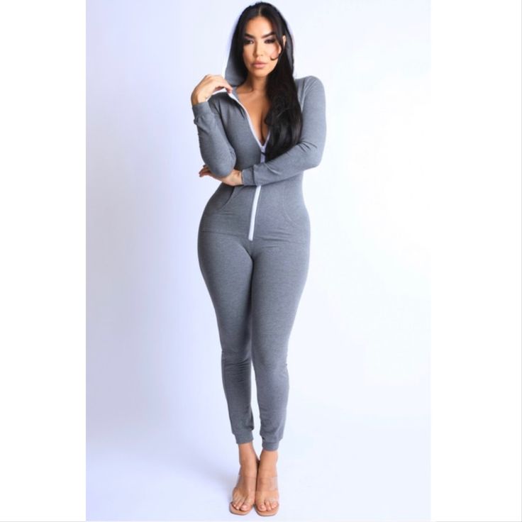 Say Hello To The Cold Weather Months In This Cozy Onesie! Charcoal Gray In Color And Features Hood, Zip Front And Pockets. This Is A Must For Fall/Winter Casual Long Sleeve Stretch Onesie, Fitted Solid Color Onesie For Loungewear, Casual Hooded Onesie For Lounging, Athleisure Long Sleeve Jumpsuits For Loungewear, Sporty Cotton Onesie For Loungewear, Gray Long Sleeve Jumpsuits And Rompers For Loungewear, Casual Winter Loungewear Jumpsuits And Rompers, Sporty Long Sleeve Jumpsuit For Loungewear, Sporty Long Sleeve Jumpsuits And Rompers For Loungewear