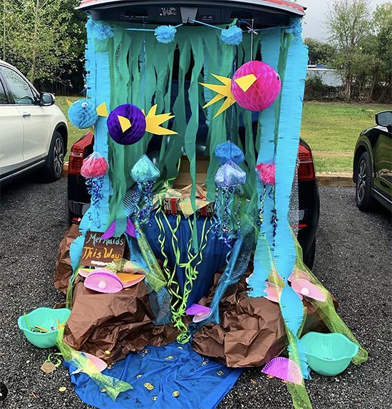 a car is parked in the parking lot with decorations on it