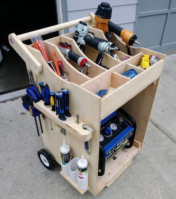 a wooden cart filled with lots of tools