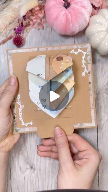 someone is making a card with scissors and paper