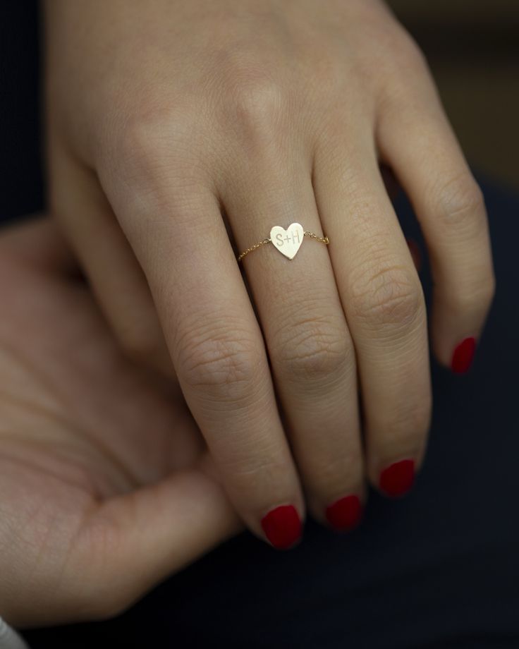 Dainty 14k gold Little Heart chain ring. Personalize this chain ring with up to 4 characters of your choice. Dainty light chain ring style, Perfect as a stacking ring or by itself. Mini heart charm measures approx. 6.5 X 7.5mm Dainty White Gold Heart Ring, Delicate 14k Gold Heart Ring For Promise, Delicate Promise Jewelry For Valentine's Day, Delicate 14k Gold Heart Promise Ring, Delicate Jewelry For Valentine's Day Promise, Dainty 14k White Gold Heart Ring, Delicate Heart-shaped Promise Jewelry, Dainty Tiny Heart Ring In 14k Gold, Dainty 14k Gold Tiny Heart Ring