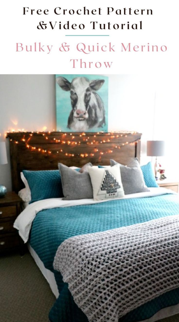 a bed room with a neatly made bed and string lights