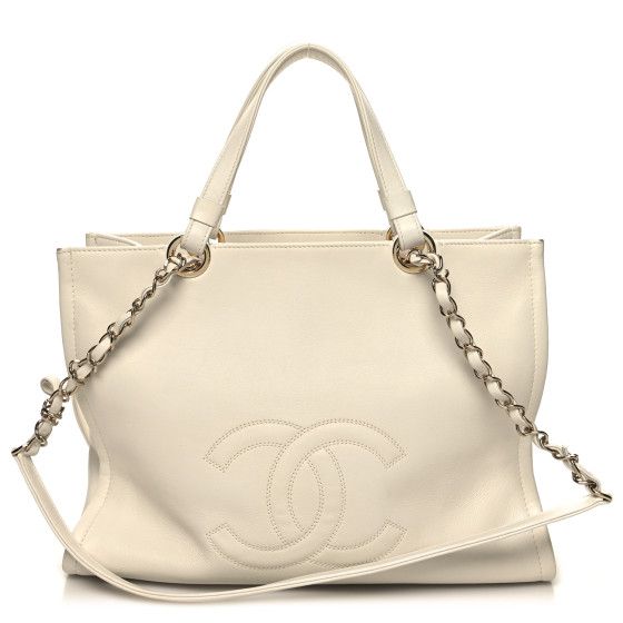 This is an authentic CHANEL Calfskin CC Zipped Shopping Tote in White. This large tote is beautifully crafted of calfskin leather in white with a large stitched Chanel CC at the front. This handy shopper features a wide patch pocket at the back andmatching leather threaded gold chain-link shoulder straps. The top is open to a spacious partitioned fabric interior with a zipper and patch pockets. Designer White Calf Leather Shoulder Bag, White Chic Calf Leather Shoulder Bag, Chic White Calf Leather Shoulder Bag, White Calf Leather Shoulder Bag With Soft Leather, Luxury Cream Shoulder Bag With Zipper Closure, White Calf Leather Shoulder Bag With Double Handle, Designer White Calf Leather Bag, White Classic Calf Leather Bag, Classic White Calf Leather Bag