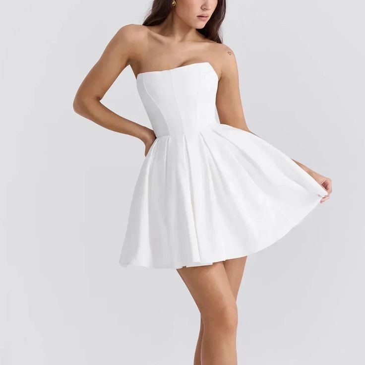 Elevate your wardrobe with this elegant strapless mini dress, meticulously designed for a perfect fit and flare effect. The timeless A-line style complements a corset style bodice, offering both comfort and allure. Ideal for everything from formal gatherings to casual celebrations, this dress adapts effortlessly to any occasion. The craftsmanship highlights a dedication to detail and quality, ensuring you look impeccable all night long. Choose from a variety of colors and sizes to find your perf Elegant A-line Lined Corset Dress, A-line Strapless Dress With Corset Back For Evening, Feminine A-line Strapless Evening Dress, Strapless A-line Dress With Fitted Bodice For Night Out, Chic A-line Mini Dress With Lined Bodice, Prom Mini Dress With Fitted Bodice And Straight Neckline, Chic A-line Corset Dress With Lined Bodice, White Fitted A-line Strapless Dress, Night Out Mini Dress With Sweetheart Neckline