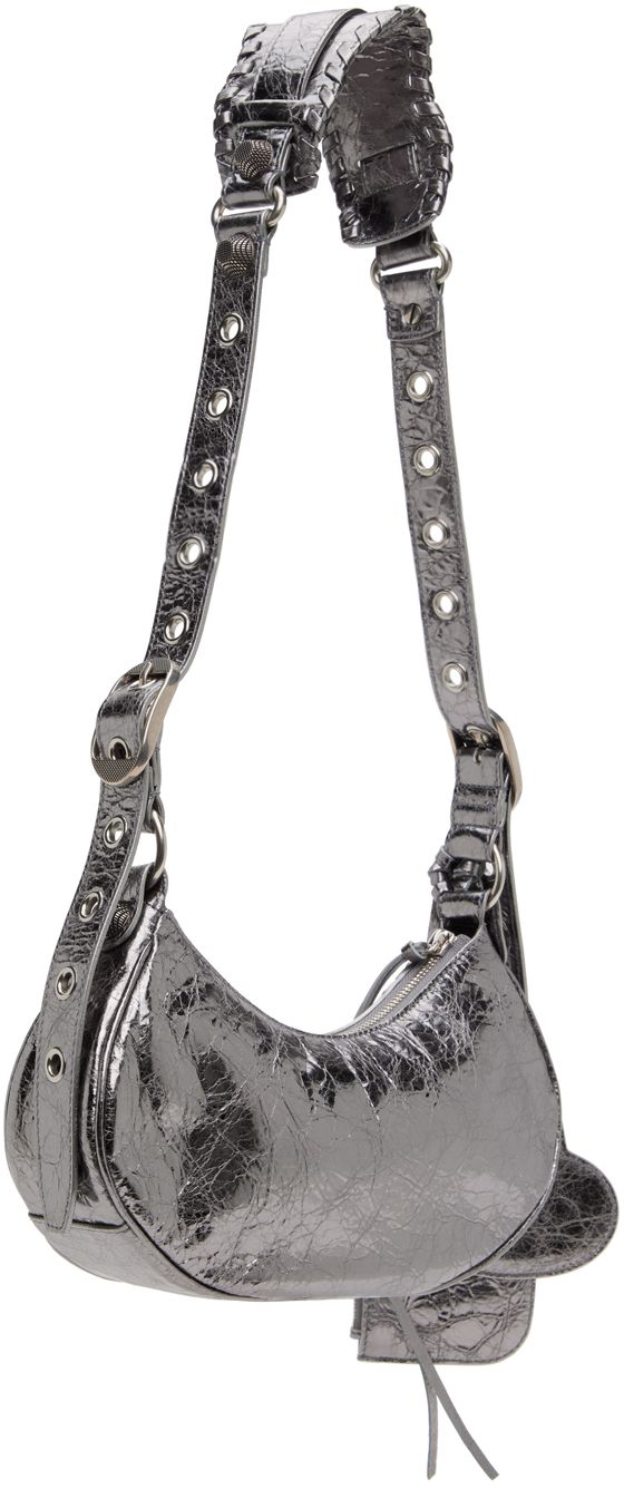 Crinkled Arena lambskin shoulder bag in metallic silver-tone. · Pin-buckle shoulder strap · Detachable zip pouch at shoulder strap · Detachable mirror · Studs and pin-buckle straps at face · Gathering at face · Zip closure · Cotton canvas lining · Antiqued silver-tone hardware · H5.5 x W10 x D2.5 in Supplier color: Silver Evening Shoulder Bag With Palladium Hardware In Metallic Silver, Metallic Silver Shoulder Bag With Palladium Hardware For Evening, Luxury Metallic Silver Shoulder Bag For Evening, Evening Shoulder Bag With Gunmetal Hardware, Metallic Shoulder Bag With Silver-tone Hardware, Silver Shoulder Bag With Detachable Strap, Metallic Shoulder Bag For Evening With Zipper, Chic Metallic Shoulder Bag With Adjustable Strap, Metallic Evening Shoulder Bag With Zipper Closure