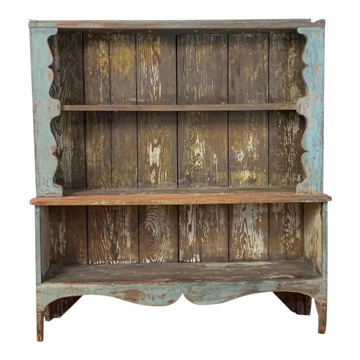 an old wooden shelf with two shelves on each side and one shelf above the other