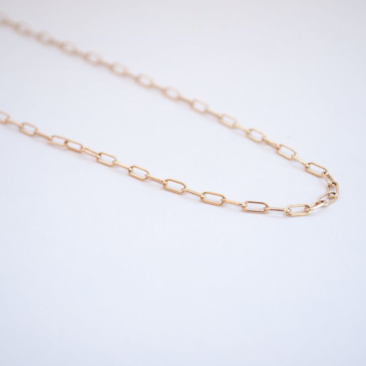 The perfect gold cable chain by Lauren Wolf to hold your charms, layer on golden sparkle, or spring a sense of subtle elegance on its own. Metal: 14k Yellow Gold Measurements: Chain width: 2.6mm, Chain: 18", 20" 18", 20" in stock Shop Chains + Charms > Everyday Rose Gold Cable Chain Necklace, Rose Gold Cable Chain Necklace For Everyday, Elegant Rose Gold Chain Necklace With Lobster Clasp, Classic Rose Gold Chain Necklace With Rectangular Links, Rose Gold Oval Link Necklace With Gold Chain, Dainty Yellow Gold Oval Link Chain Necklace, Dainty Rolo Chain Link Necklace, Timeless Everyday Gold Chain Necklace, 14k Gold Rose Gold Chain Link Necklace