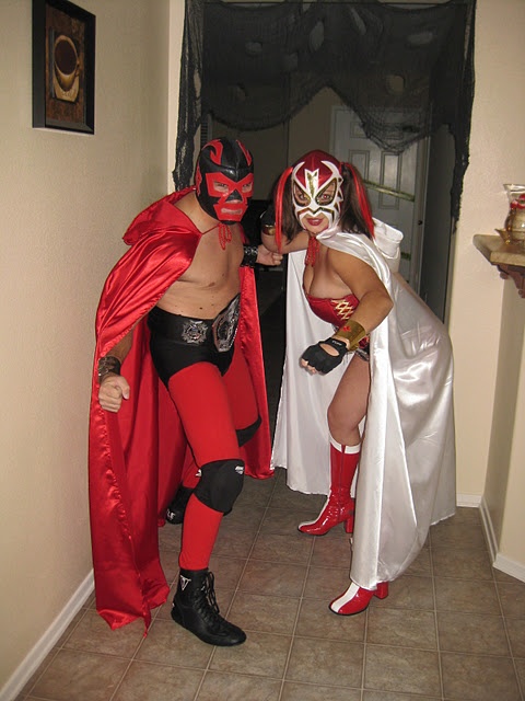 two people dressed in costumes standing next to each other