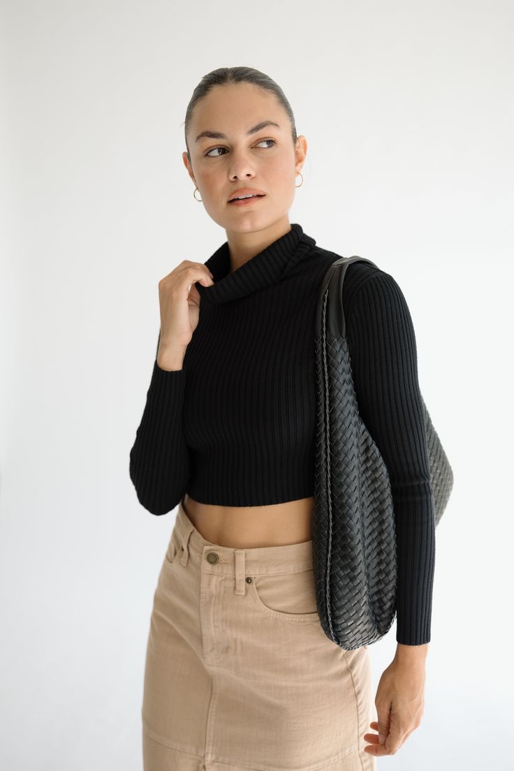 The Kora Top. Introducing the Kora Top, Style Details: -ribbed material -long sleeve turtleneck style -available in black or grey Model Measurements: Model is wearing a size Small Black Ribbed Funnel Neck Sweater, Chic Everyday Turtleneck Sweater, Versatile Ribbed Sweater For Fall, Stretch Turtleneck With Ribbed Neckline For Fall, Trendy Black Knit Turtleneck, Black Ribbed Turtleneck For Winter, Versatile Stretch Turtleneck For Fall, Black Ribbed Long Sleeve Turtleneck, Fitted Black Versatile Turtleneck