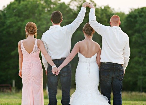 the bride and grooms are holding hands