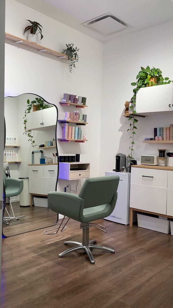 a salon with chairs, mirrors and plants