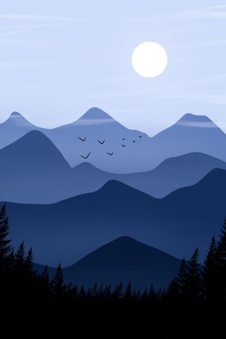 birds flying over the mountains at dusk