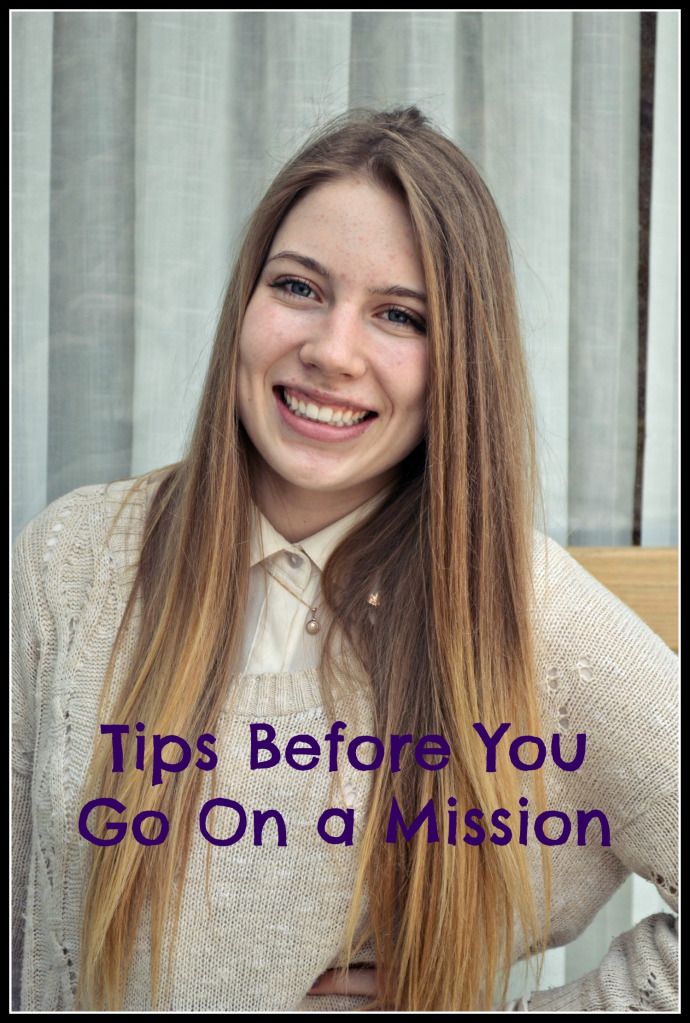 a woman with long blonde hair smiling and wearing a white shirt that says tips before you go on a mission