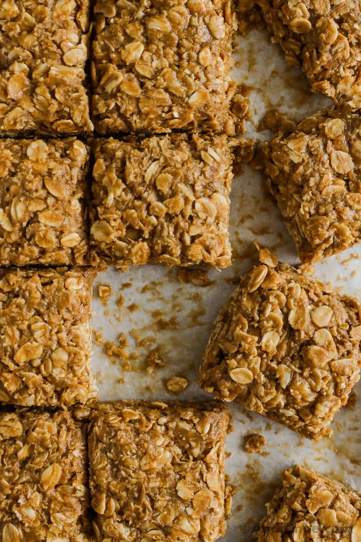 homemade granola bars stacked on top of each other with oats in the middle