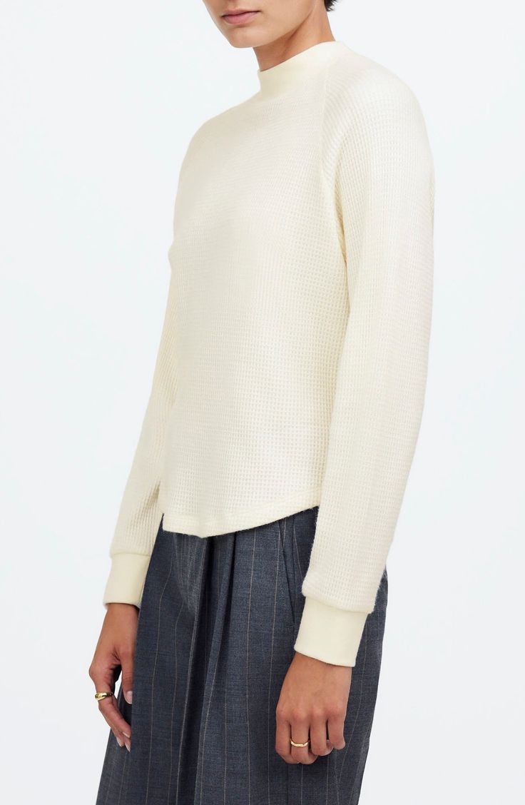 Made of cozy, textural waffle knit, this long-sleeved tee features a ribbed crew neckline and sporty raglan sleeves. Laid-back and oversized, it's the perfect blend of cute and comfy. 22 1/2" length (size Medium) Crewneck Long sleeves 50% viscose, 30% polyester, 20% polyamide Machine wash, dry flat Imported Spring Textured Knit Long Sleeve Crew Neck Top, Fall Layering Waffle Knit Sweatshirt, Spring Crew Neck Long Sleeve Top With Textured Knit, Fall Waffle Knit Sweatshirt For Layering, Sporty Ribbed Sweater For Spring, Sporty Ribbed Spring Sweater, Long Sleeve Waffle Knit Sweatshirt For Fall, Fall Waffle Knit Long Sleeve Sweatshirt, Spring Crew Neck Sweatshirt With Textured Knit