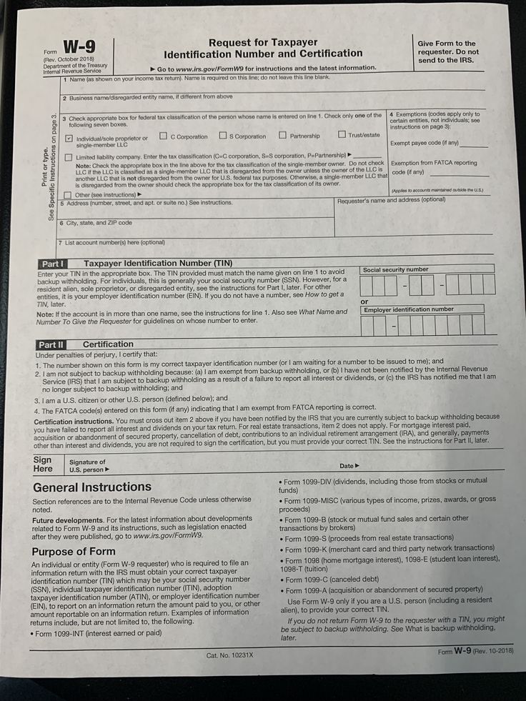 a paper with the form w - 9 on it sitting on top of a table