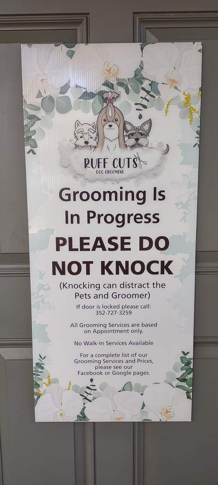 a sign is posted on the front door of a building that says, grooming is in progress please do not knock